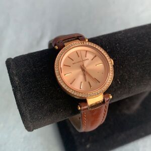 Michael Kors rose gold face with brown leather strap watch